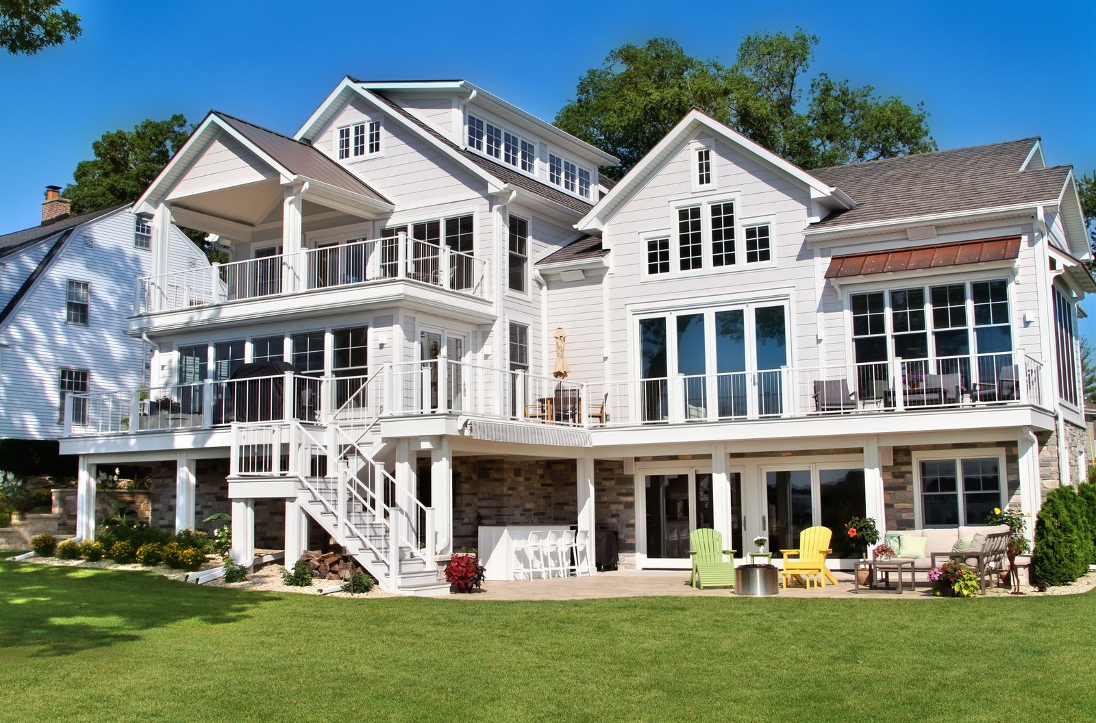 The finished Burlington lakehouse rear elevation with landscaped lawn
