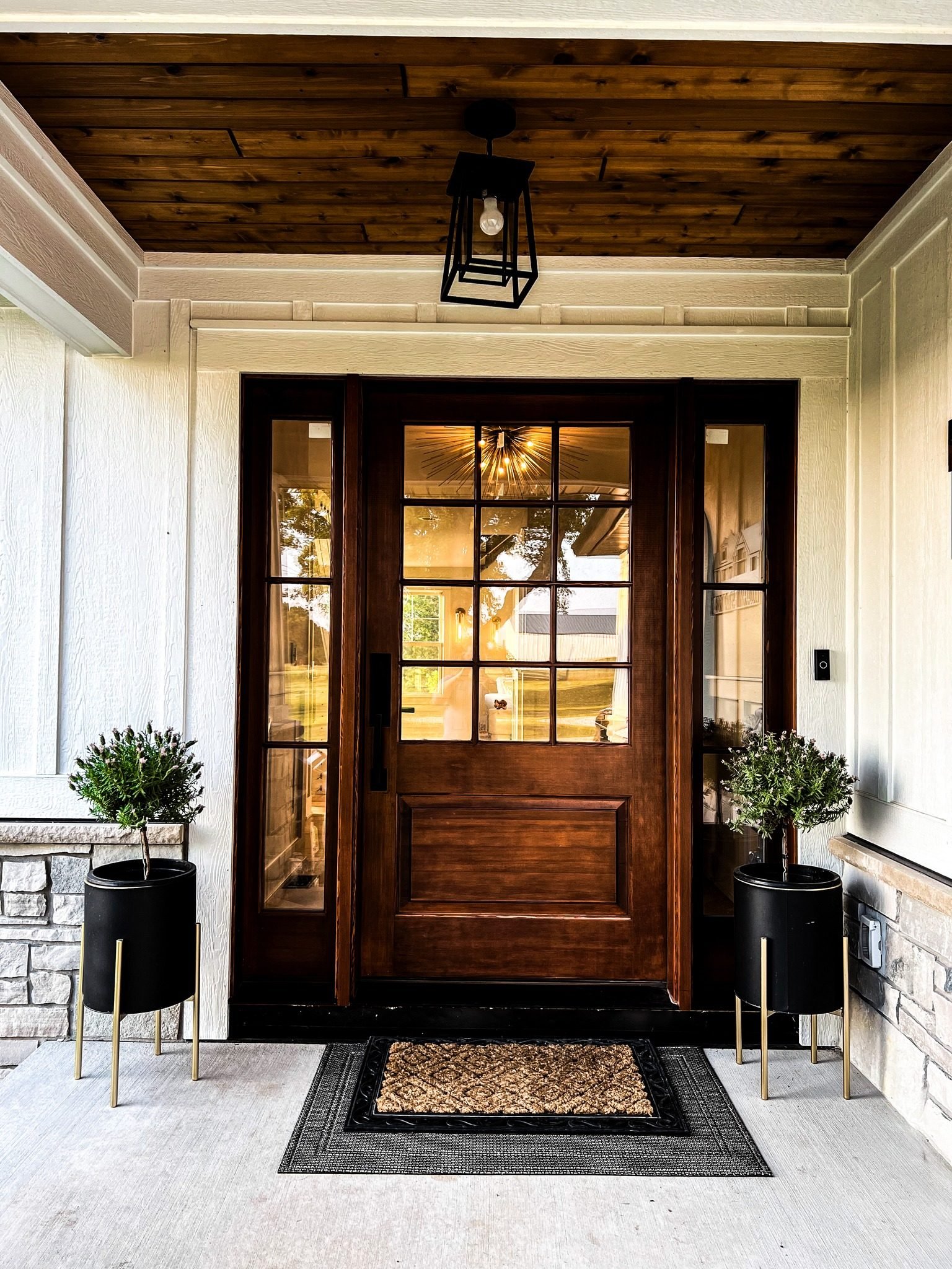 Custom wood front door framed in timber at a Monien Construction home